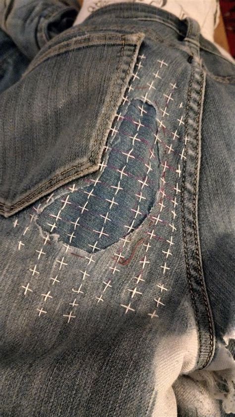 First attempt at Sashiko mending on my jeans (stitch lines will wash off!) : Visiblemending