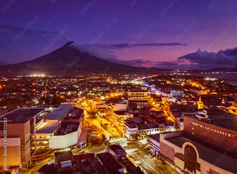 Mayon Volcano with Legazpi City lights in Legaspi City Albay Philippines Stock Photo | Adobe Stock