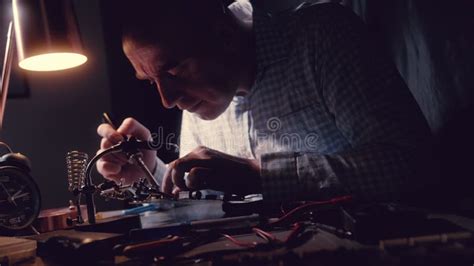 Repairing a Microcircuit, Smoke from Soldering Iron.Disconnect Radio Components.Scheme with ...