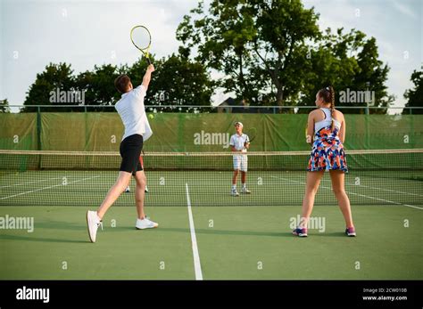 Mixed doubles tennis players, outdoor court Stock Photo - Alamy