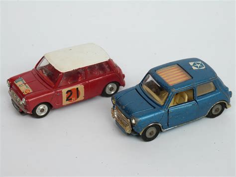 Eighteen Corgi Toys diecast model cars including Mini, Olympics car, Driving School etc