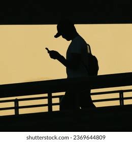 Photo Silhouette Person Using Their Phone AI-generated image 2369644809 ...