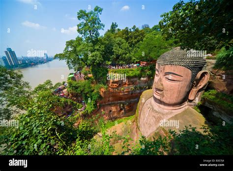 Leshan Buddha Dafo Sichuan Province China with Leshan city town across river in background ...