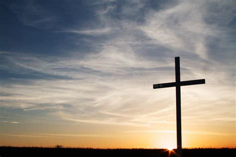 A Christian Cross at Sunset Stock Photo - Image of symbol, sign: 107444776