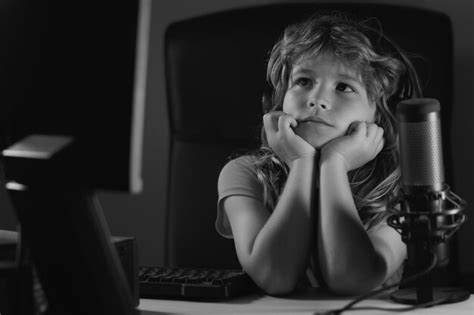 Premium Photo | Child with pc computer at night school study online learning concept overuse and ...