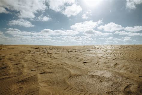 Closeup Shot of Sandy Landscape with Beautiful Skyline with Clouds and ...