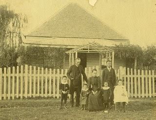 Family group | Family grouped in front of picket fence, woma… | Flickr