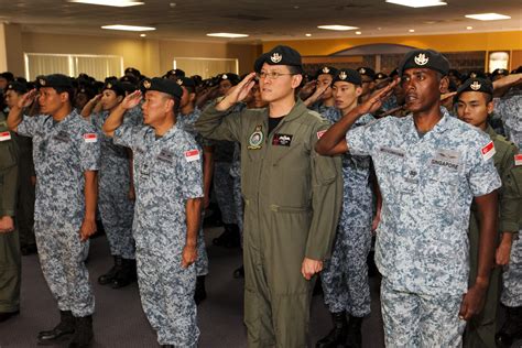 Republic of Singapore Air Force personnel sing their national anthem ...