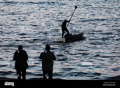 Palestinian fishing boats in the Gaza sea at sunset in Gaza City ...