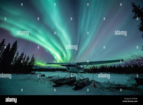 Northern lights above a plane at night, Whitehorse, Yukon, Canada Stock ...