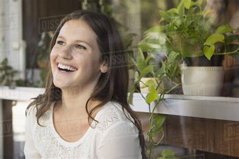 Caucasian woman laughing outdoors - Stock Photo - Dissolve