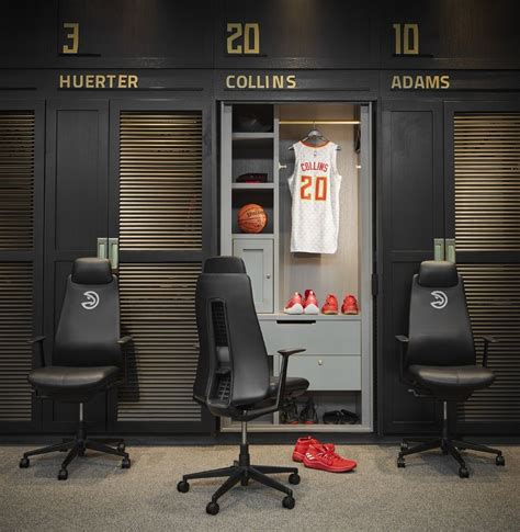 The locker room's black and gold palette and spotlights on each locker create an elegant ...