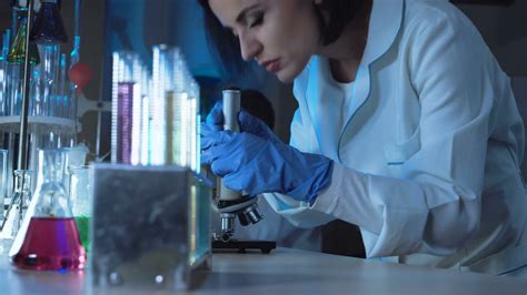 Scientist Examining Microscope In Colorful Stock Footage SBV-315904833 - Storyblocks