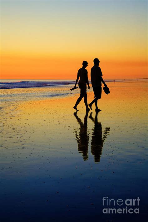 Young Couple On Romantic Beach At Sunset Photograph by Colin and Linda McKie