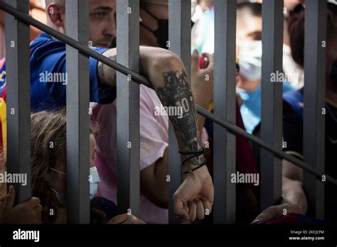 F.C. Barcelona fans gather out of the Barca stadium in Barcelona, Spain ...