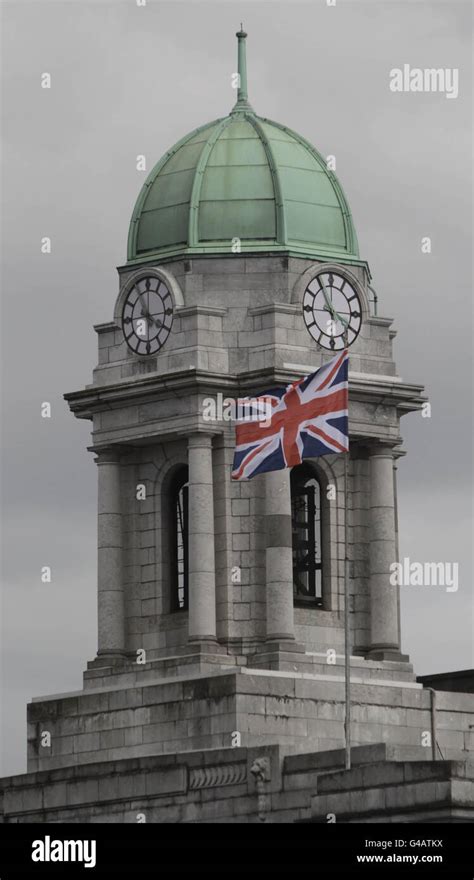 A union flag is seen above Cork City Hall as Queen Elizabeth II visits the English Market in ...