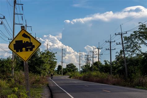 View of rural road with warning signs across the railway. 7549262 Stock ...