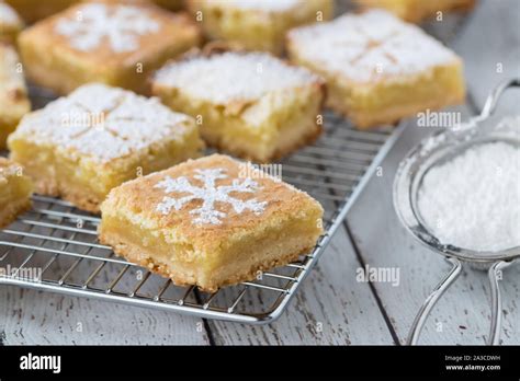 Lemon squares with powdered sugar Stock Photo - Alamy