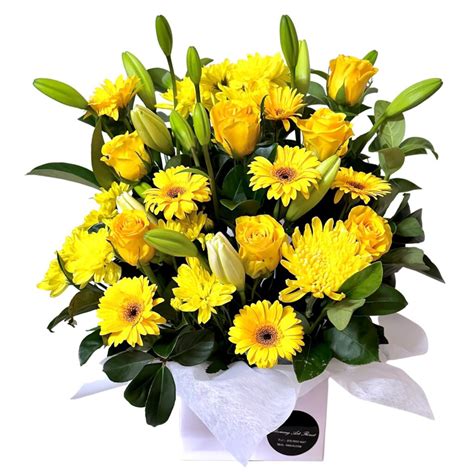 Gorgeous yellow flowers in a box Yellow Flowers in a Box - Blooming Art ...