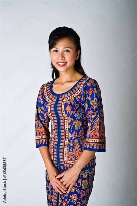 Beautiful Singapore girl in traditional dress Stock Photo | Adobe Stock