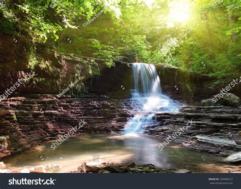 Tranquil Waterfall Scenery In The Middle Of Green Forest Stock Photo ...