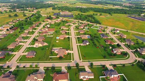 Scenic, Affluent Suburban Neighborhood in Morning Light, Aerial View 1300829 Stock Video at Vecteezy