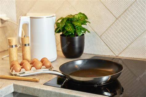 Premium Photo | Induction hob with frying pan kitchen appliance