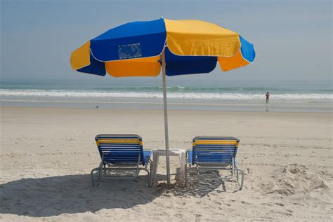 Beach chairs and umbrella 1313210 Stock Photo at Vecteezy