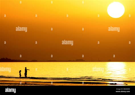 Sunset at Shatti beach in Muscat, Oman Stock Photo - Alamy