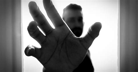 Grayscale Photo of Man Grabbing Using Right Hand · Free Stock Photo