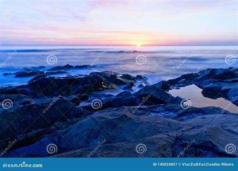 Beach sunset in Oporto stock image. Image of travel - 145024857