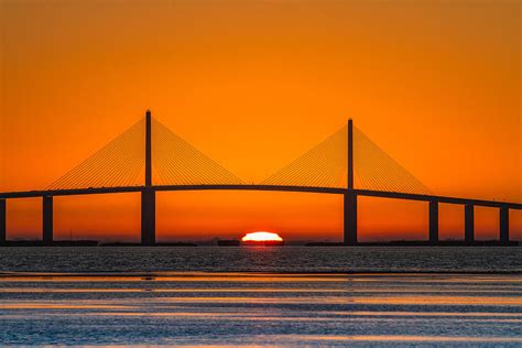 Sunrise through the Skyway Bridge Photograph by Jeff Donald - Fine Art America