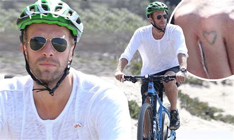 Chris Martin unveils tattoo on his knuckle while cycling in Malibu ...