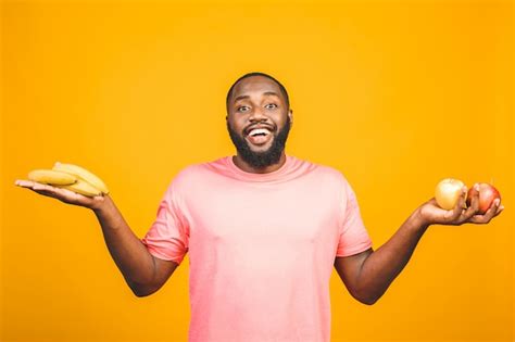 Premium Photo | Diet concept. healthy african american black man holding fruits.