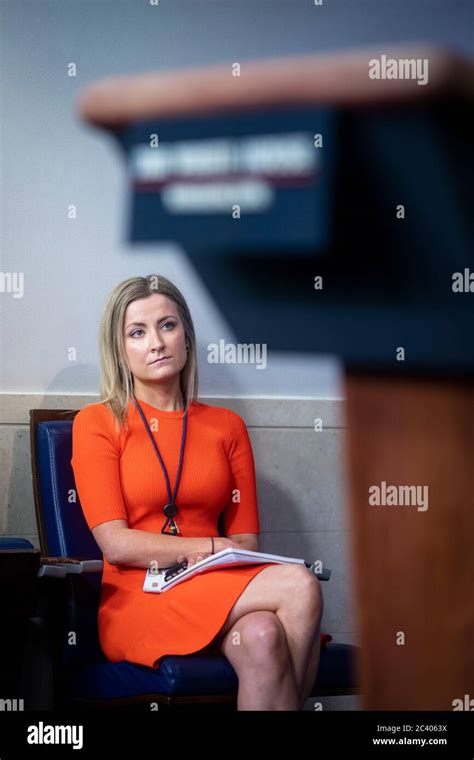 Sarah Matthews, White House deputy press secretary, listens during a ...