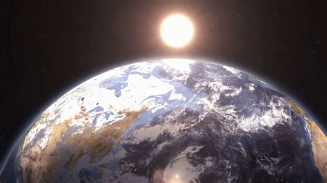 Earth Rotating In Space As The Sun Rises With Bright Flare 2 Stock Video Footage - Storyblocks