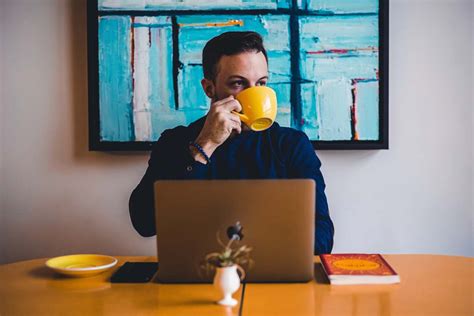 Coffee Man Drinking Coffee In Front Of The Laptop Computer Drinking Image Free Photo