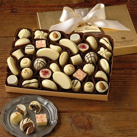 The gift of a box of chocolates is a classic one, and our assortment of… | Gifting Chocolate ...