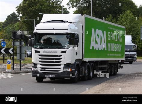 An Asda truck traveling around a roundabout in Coulsdon, Surrey, England Stock Photo - Alamy