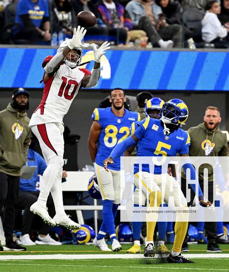 Cardinals receiver DeAndre Hopkins catches the ball over Rams Jalen ...