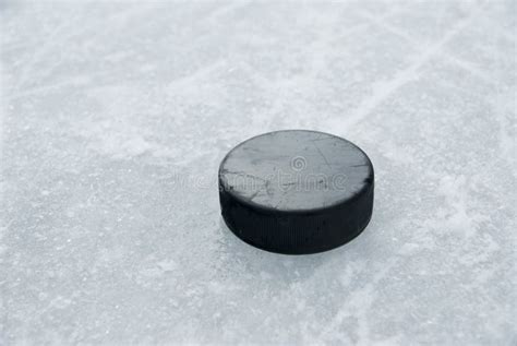 Hockey Puck On Ice Royalty Free Stock Image - Image: 23816956