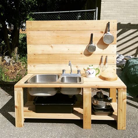 A Diy Mud Kitchen With Reclaimed Sink And Running Water Via Garden Hose ...