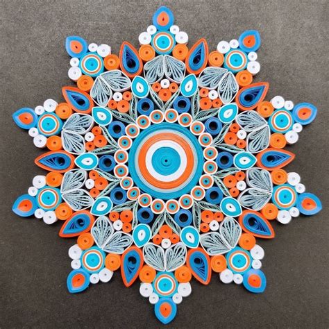 an orange, blue and white circular object with circles on it's center piece