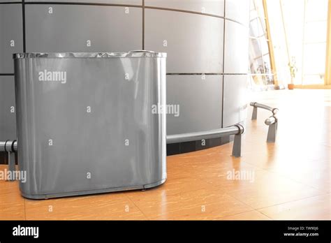 Metal trash bin indoors. Recycling concept Stock Photo - Alamy