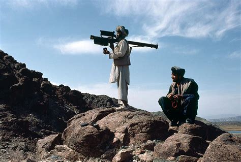 An Afghan mujahideen aims a FIM-92 Stinger missile at passing Soviet ...