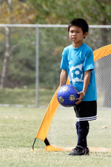 Young Boy Playing in Soccer Stock Photo - Image of kids, children: 276368