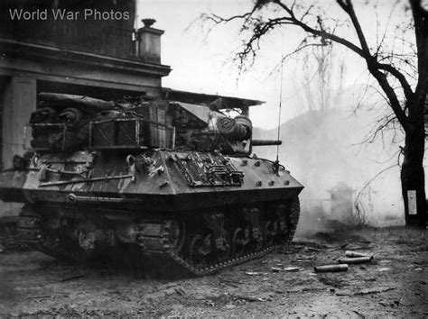 M10 tank destroyer from the 803rd Tank Destroyer Battalion firing on a ...