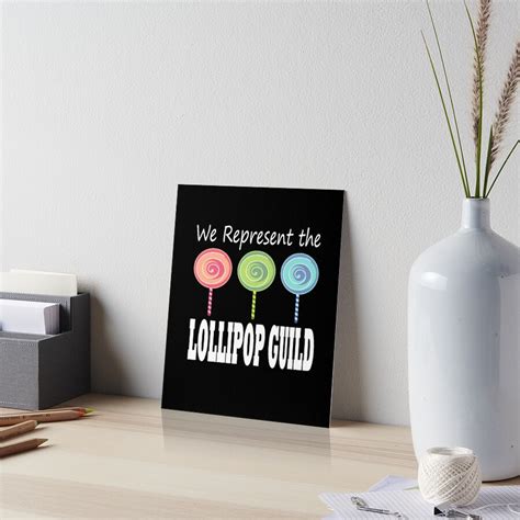 "We Represent The Lollipop Guild Wizard Of Oz " Art Board Print by winkingstar | Redbubble