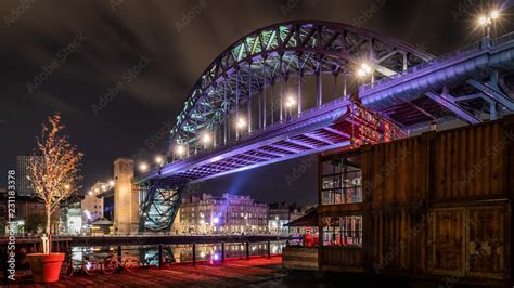 The Tyne Bridge illuminated at night showing the Newcastle quayside ...