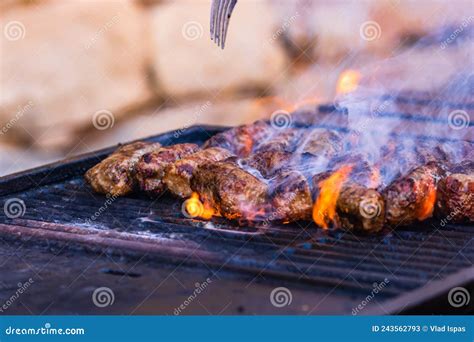 Preparing Meat Rolls Called Mici or Mititei on Barbecue. Close Up of ...